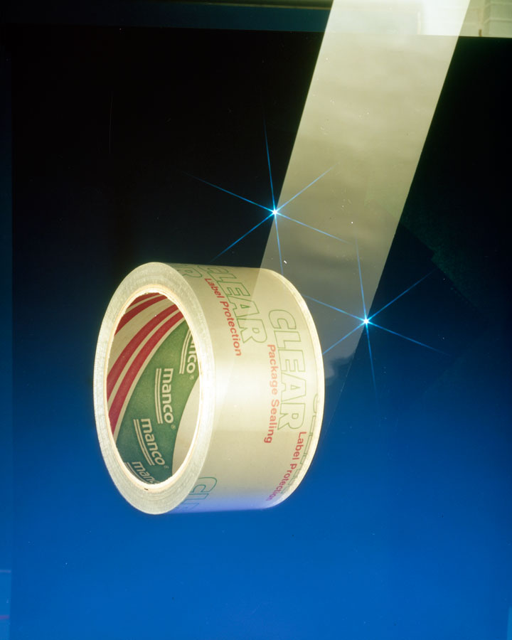 clear-packaging-tape-rolled-out-on-blue-background