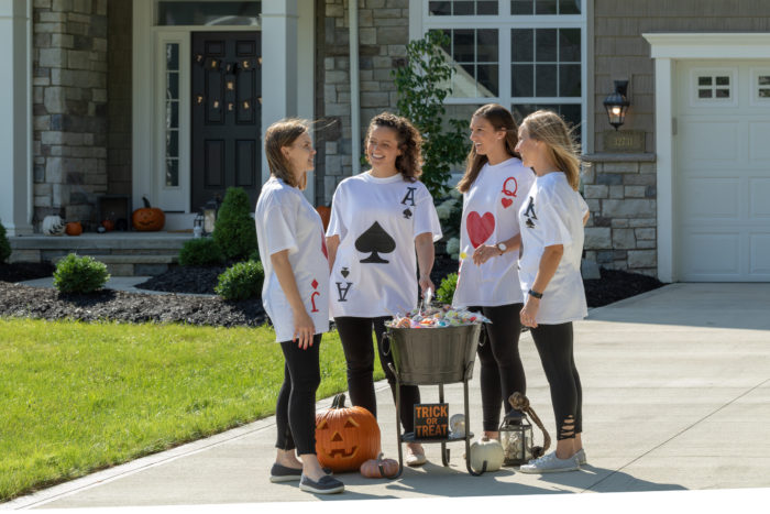 Four children in playing card costumes