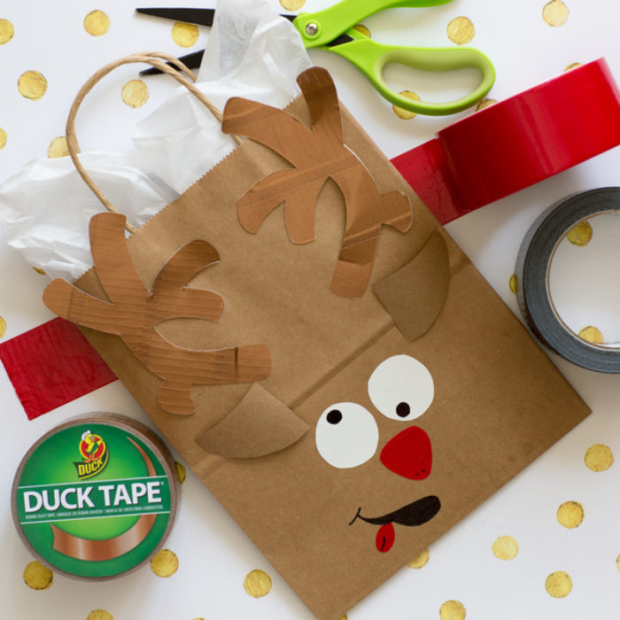 A paper bag decorated as a reindeer.