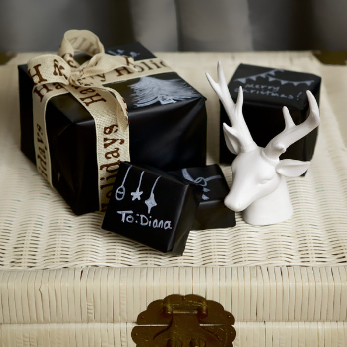 Gifts wrapped in black, chalk board Duck Tape.