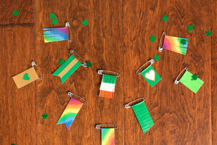 A collection of St. Patrick's Day pins made with colored Duck Tape