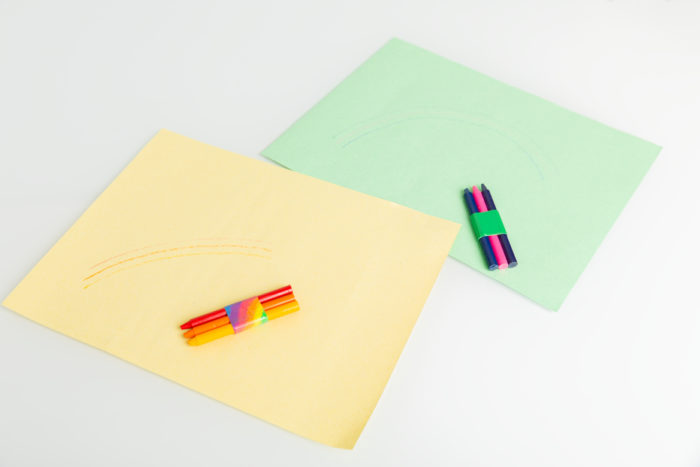 A set of crayons taped together with colored Duck Tape