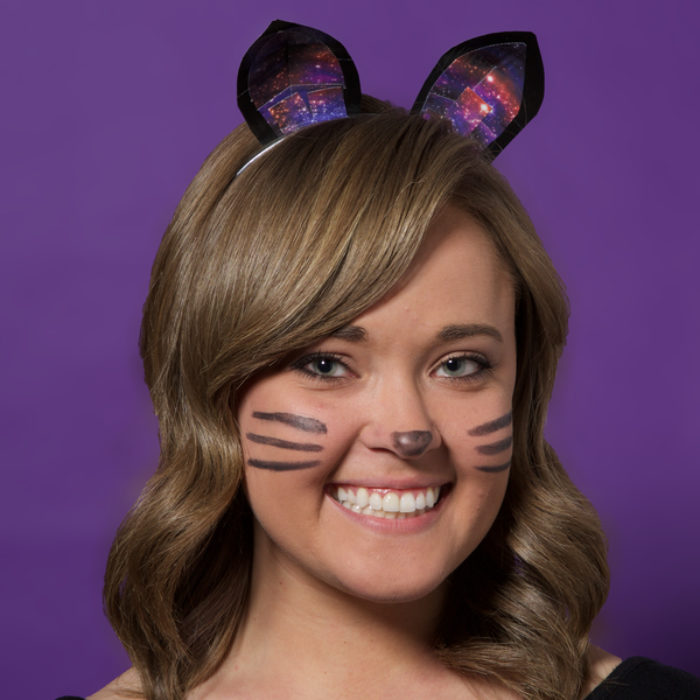 A woman dressed up as a cat and wearing Duck Tape cat ears.