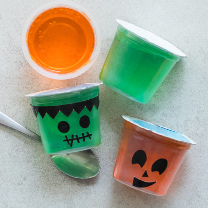 Jell-O cups with Halloween faces on them.