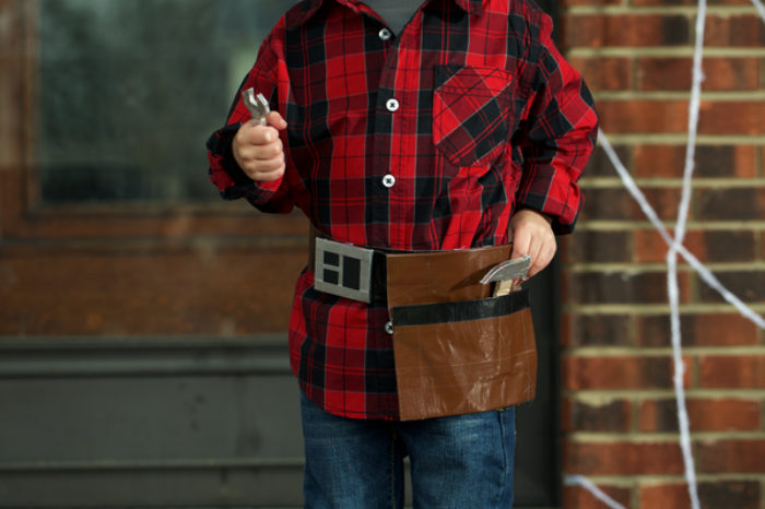 A tool belt made of Duck Tape holding toy tools