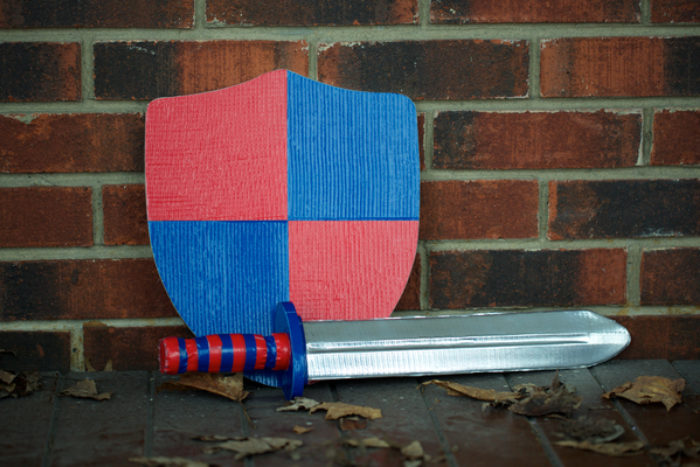 A toy sword and shield made out of Duck Tape.