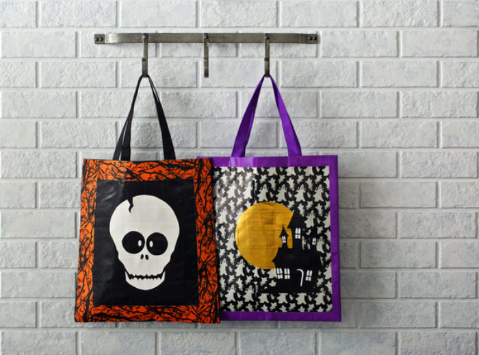 Two Halloween candy bags, decorated with glow in the dark and Colored Duck tape.