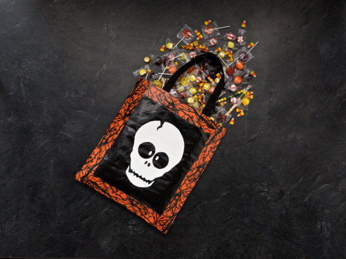 Candy bag with a Duck Tape skull decoration on it.