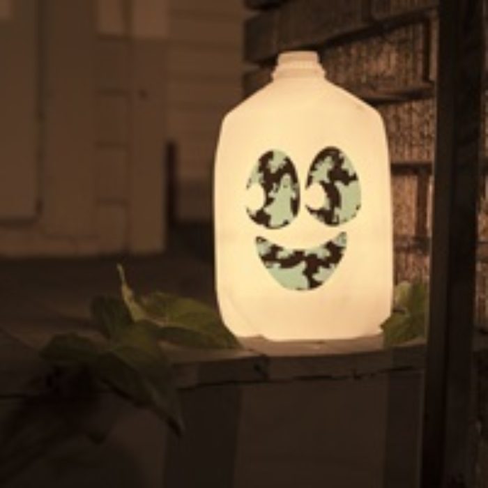 A glow in the dark milk jug with a Duck Tape skull on it.