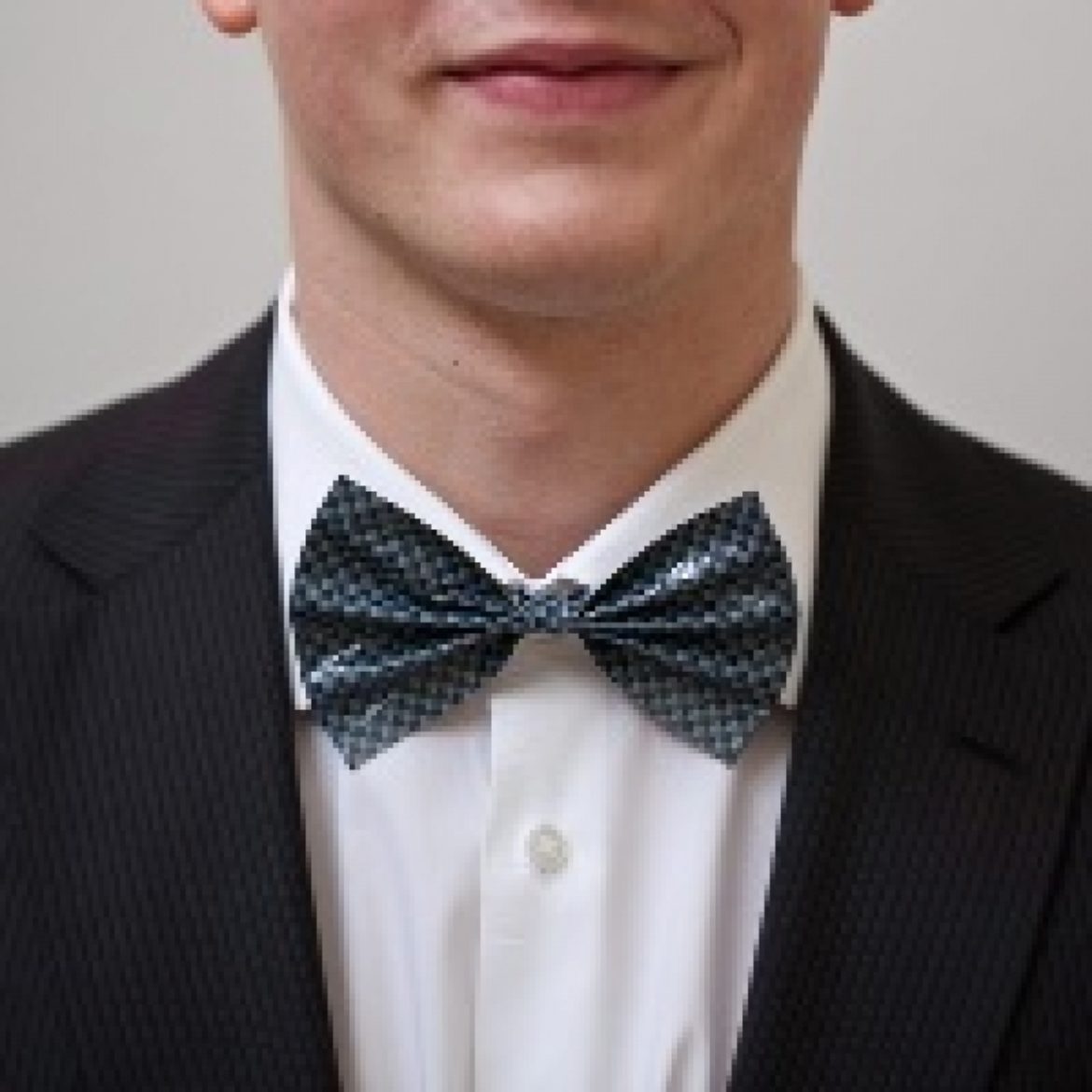Finished Duck Tape Bow Tie worn by a young man in a suit
