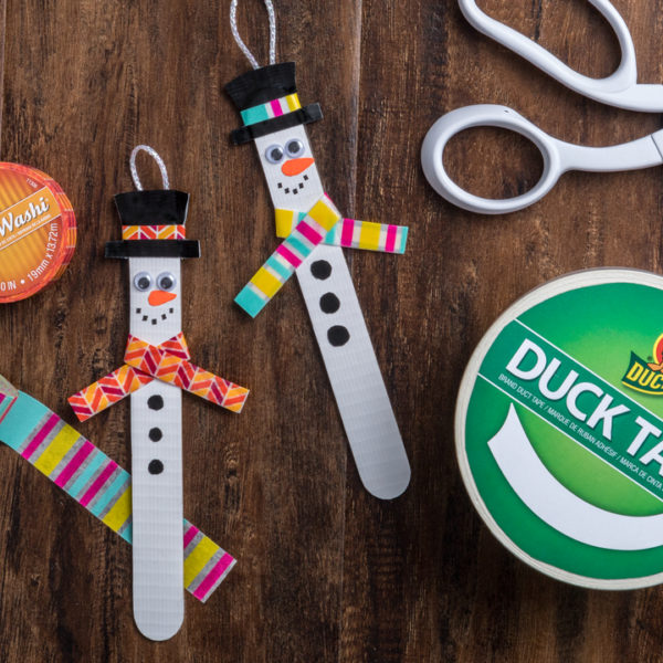 Snow men fashioned from popsicle sticks and Duck Tape