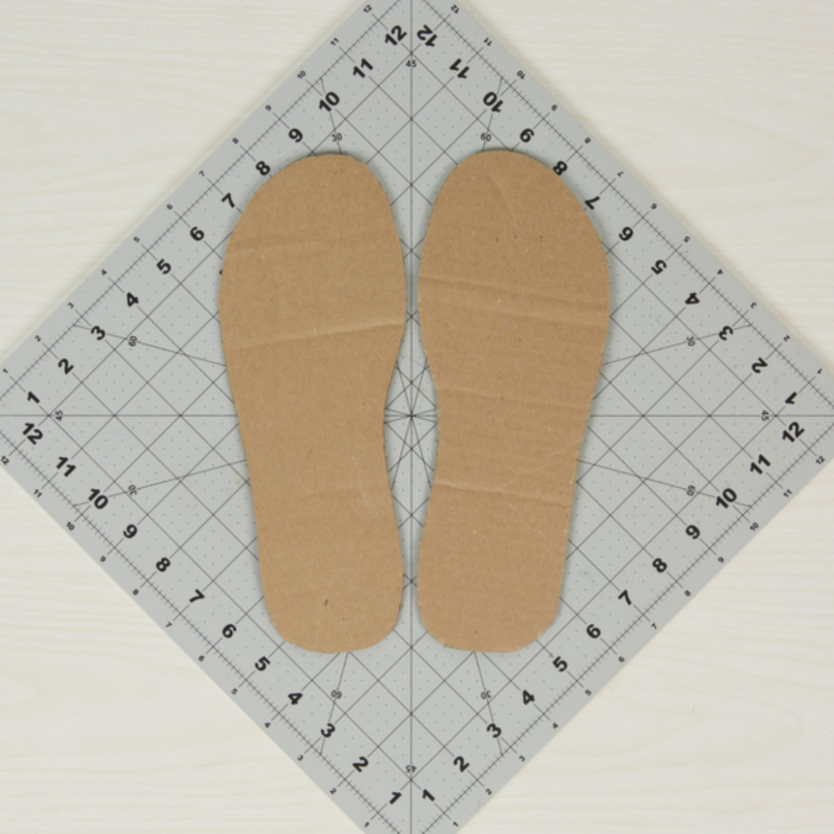 flip flop shape traced onto cardboard and cut out