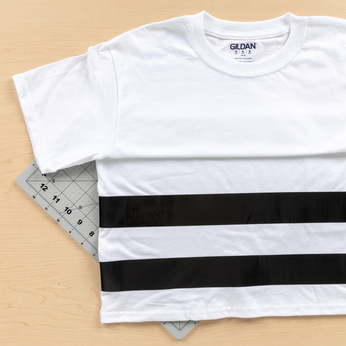 Strips of black Duck Tape added to a white T-shirt