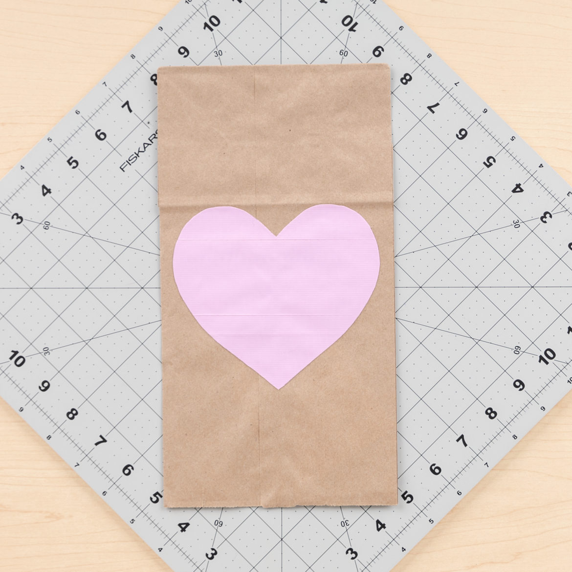 heart from the previous step attached to the paper bag