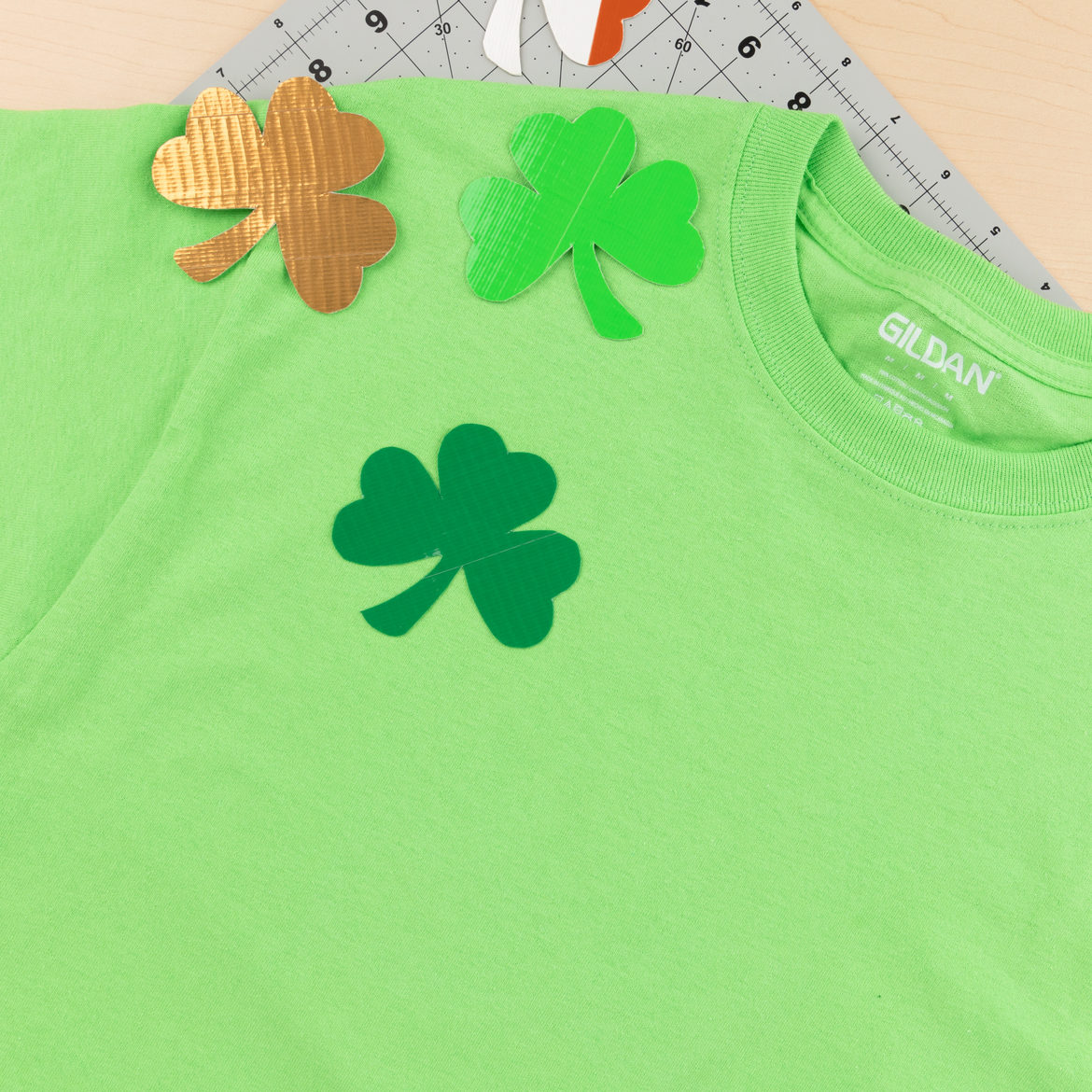 peel away the wax paper and apply the shamrock to shirts