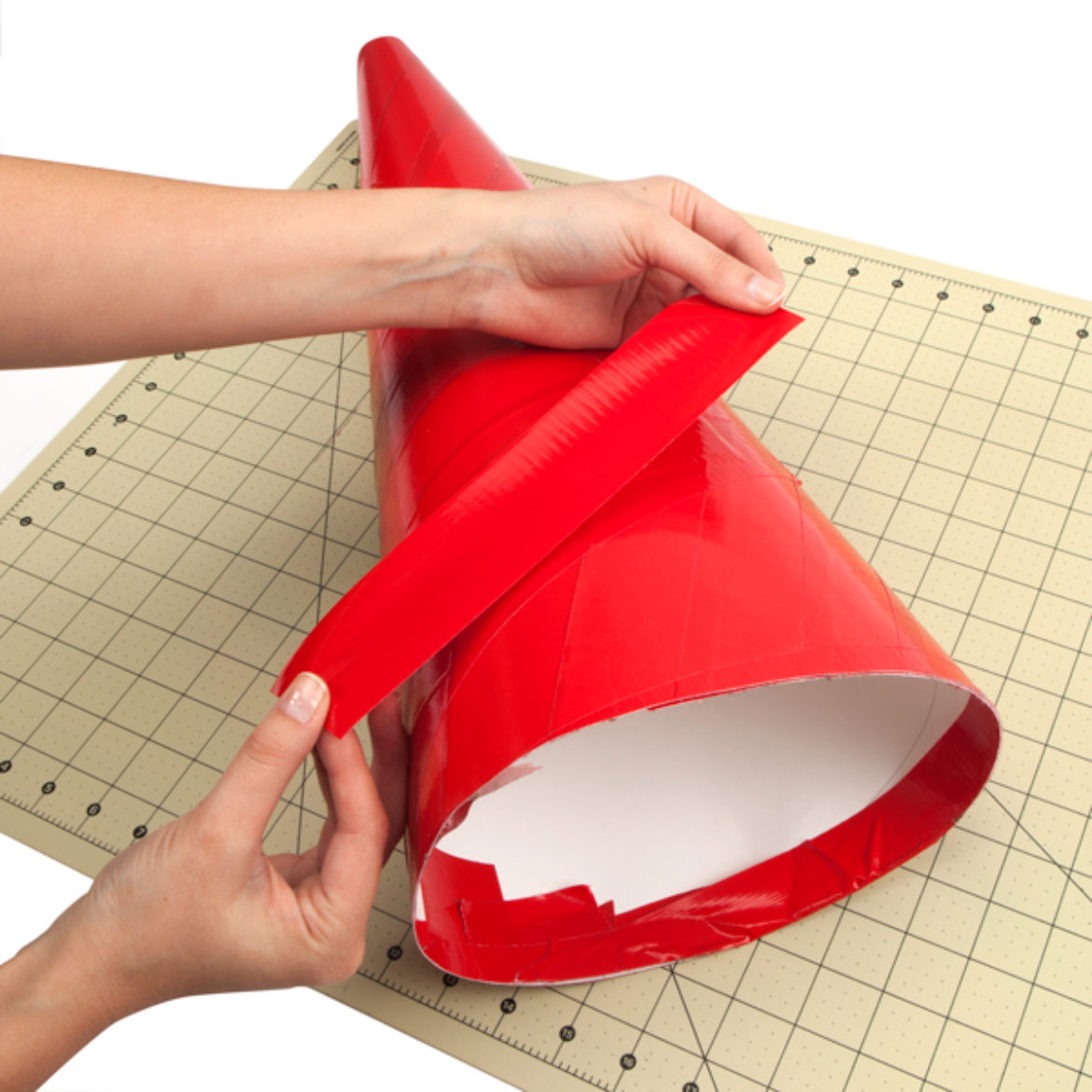 Poster board bent into the shape of a cone and held in place by a strip of Duck Tape
