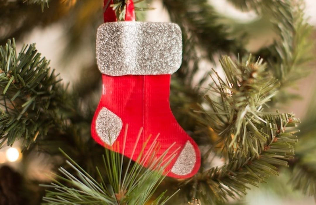 Duck Tape® Mini Stocking Ornaments hanging on a tree