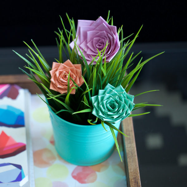 Finished Duck Tape® Roses in a planter example with grass inside