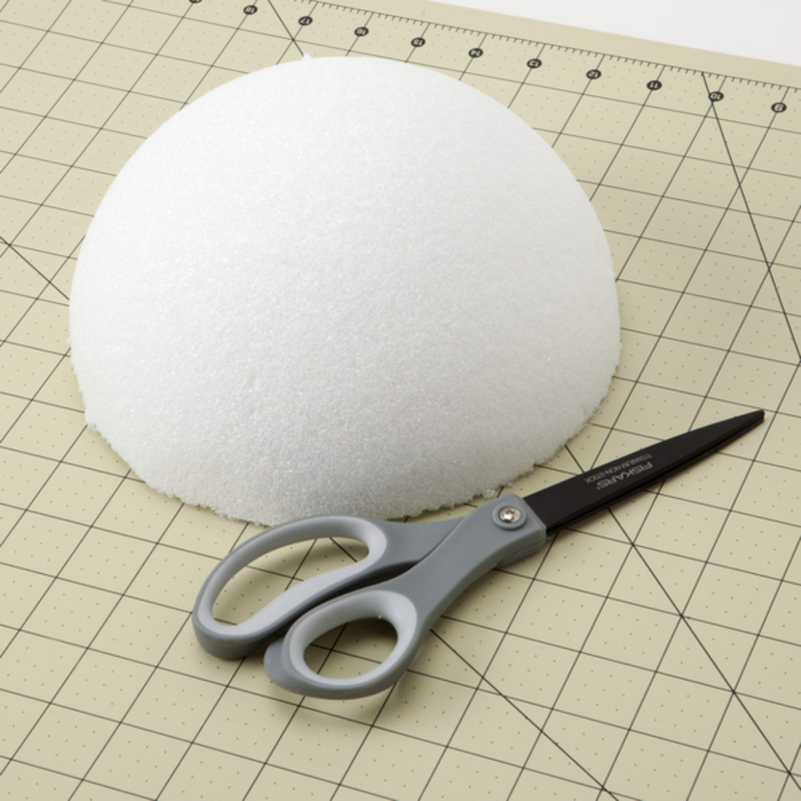 Cut foam ball in half to create a dome shape