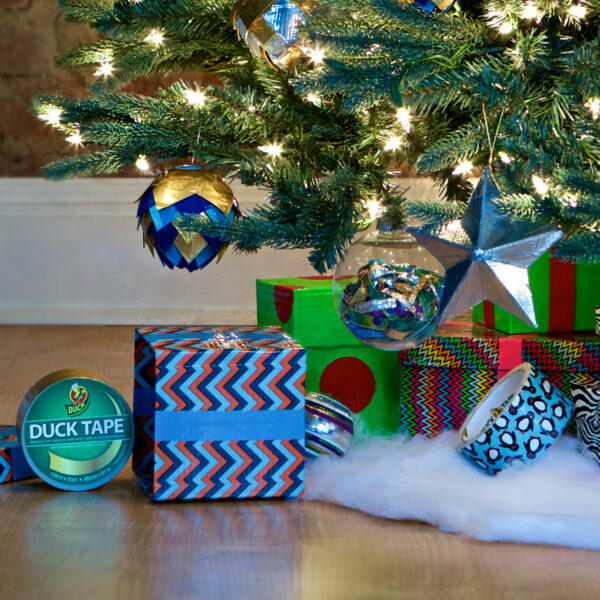 Lifestyle image of duck tape rolls, present wraps, and ornaments