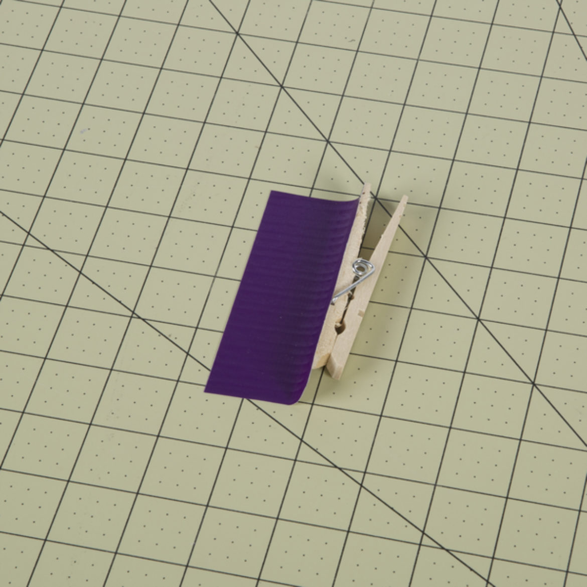 top of a clothes pin covered in purple Color Duck Tape